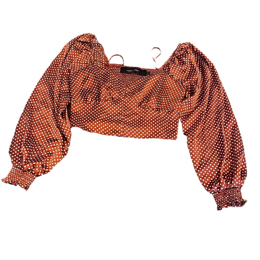 Brown polyester cropped top with white poker dots and puffy sleeves. Size Medium